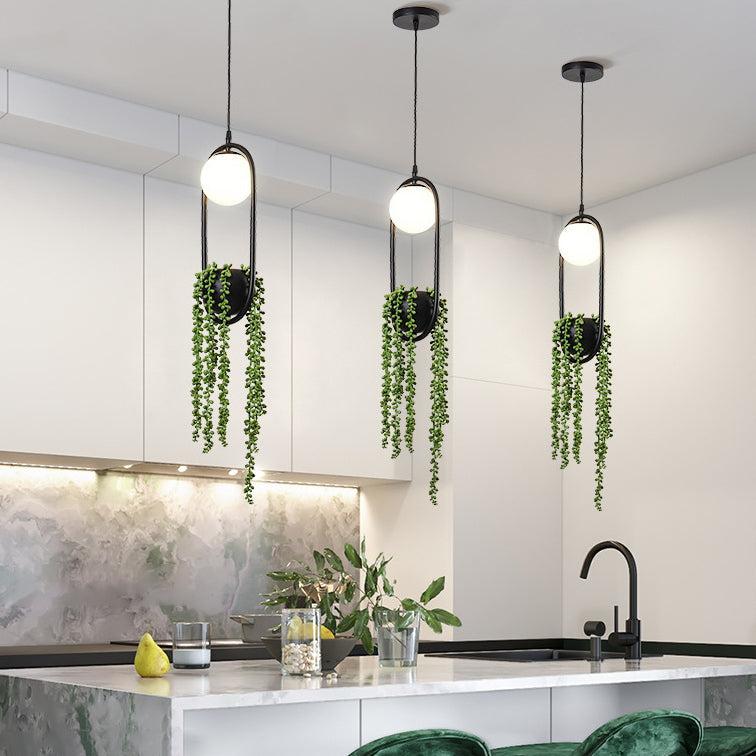 20240507144406-1.jpg Modern Art Deco Iron Glass Elliptical Simulated Greenery 1-Light Pendant Light For Dining Room - Image 1