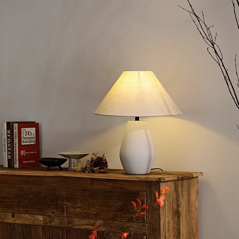 BS-Lighting-LL04514-3-0682a0c7-8046-472d-8946-5e0b8addb493.jpg Traditional Vintage Fabric Tapered Shade Ceramic Bottle Base 1-Light Table Lamp For Bedroom - Image 1